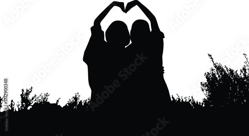 Silhouette of two friends making heart shape with hands, friendship love concept, romantic bond, nature background, together forever unity
