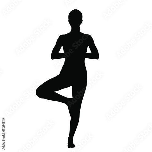 A woman practicing a tree pose in a striking black silhouette
