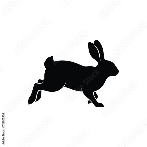 A leaping rabbit form presented as a striking black silhouette