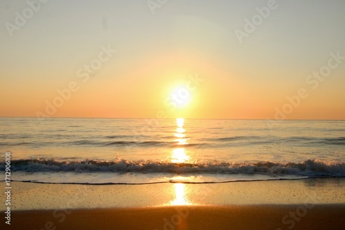 Sunrise reflections on the beach 