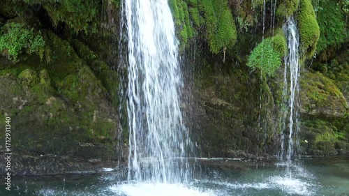 Kaghu waterfall. Magnificent moss covered levitating rock waterfall in the heart of the Caucasus mountains
