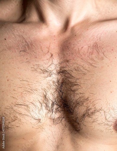 Close-up of a man's chest with visible hair