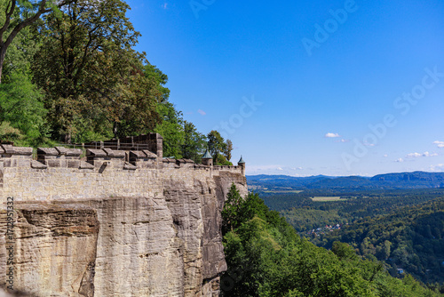 Billede på lærred Stone wall of Festung Königstein (Königstein Fortress) with panoramic view of Saxon Switzerland, Germany