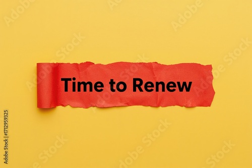It's time for a fresh start: Words on torn red paper against a yellow backdrop. Renewal theme with ample copy space.
