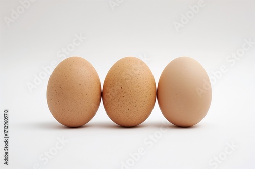 Three Eggs Displayed on a P...