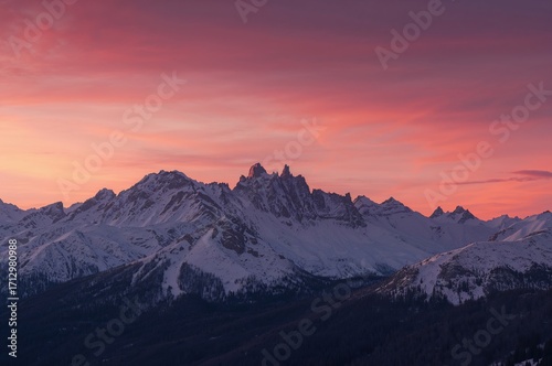 Dusk over snowy peaks with ...