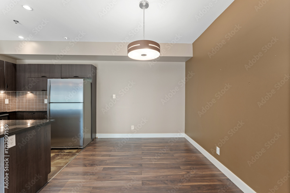 Obraz premium Kitchen with a refrigerator and a sink