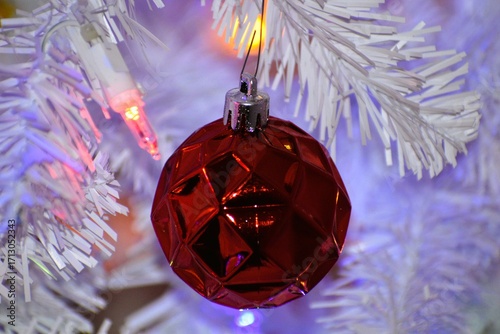 Red Textured Ornament Hanging on White Christmas Tree