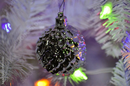 Silver Textured Ornament on White Christmas Tree