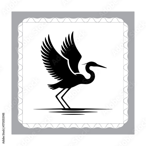 Black and White Heron Silhouette in a Marsh with Reeds Reflected in the Water Creating a Serene Wildlife Scene