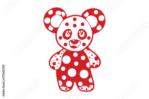 Red polka dotted bear stands smiling happily against a plain background looking hopeful and content