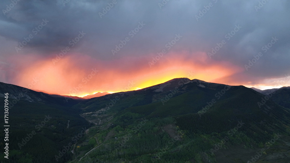 Obraz premium Beautiful drone sunset view over storm clouds mountain landscape