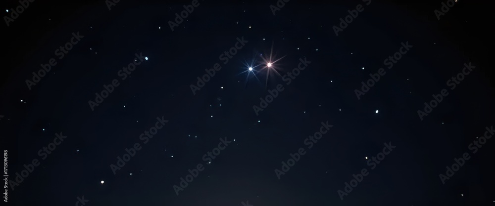 Fototapeta premium A bright star shines brightly in the dark night sky.