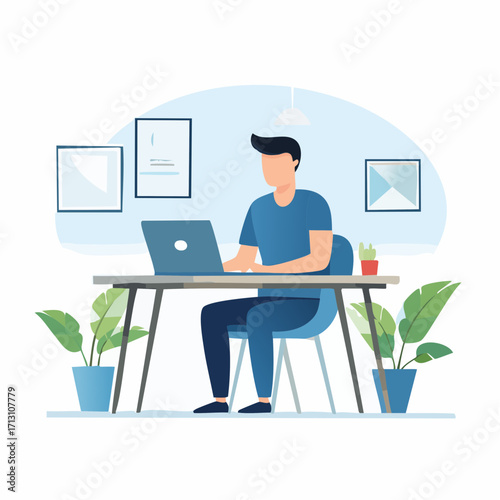 Young professional male freelancer working remotely on a laptop computer at a modern desk in a home office setting