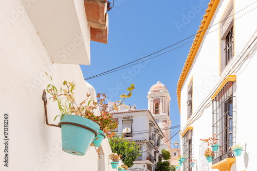Estepona, Malaga, Andalusia, Spain. 3 September 2025. Wall with flower pots