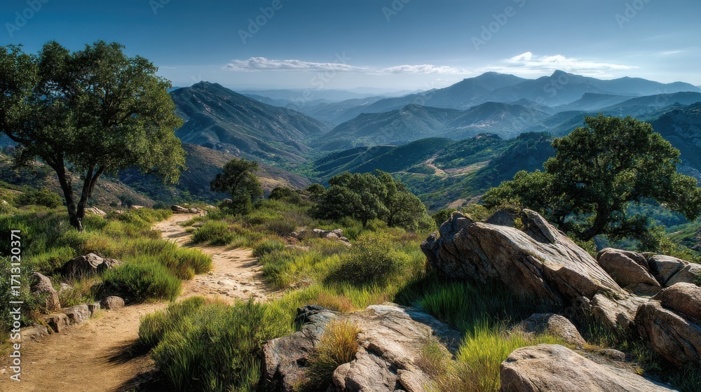 Obraz premium Breathtaking Mountain Landscape with Rolling Hills, Lush Greenery, and Rocky Pathway Amidst a Serene Sky in the Early Morning Light