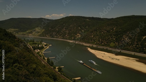 Wallpaper Mural This picture shows a river that flows in a valley between two hills with forests on. Shot with a DJI drone Torontodigital.ca