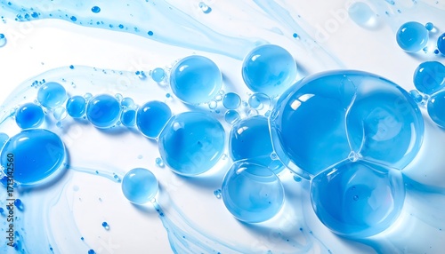 A close-up view of translucent blue bubbles, arranged in an abstract pattern on a white background.
