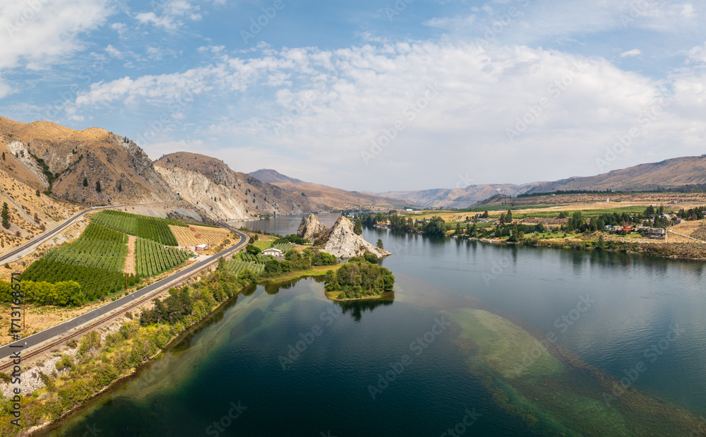 Fototapeta premium Aerial drone view of Columbia River by Maplecreek and Orondo in Washington with two rock outcroppings in the river