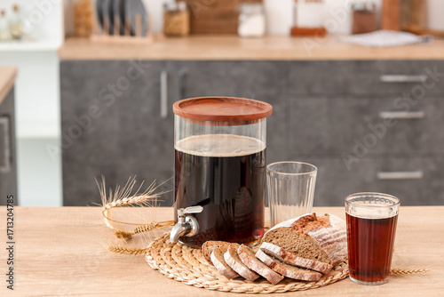 Jar of tasty kvass with gla...