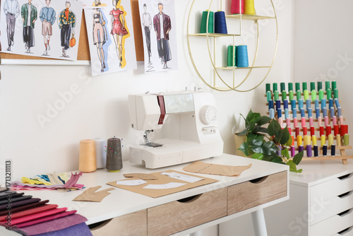 Tailor's workplace with sew...