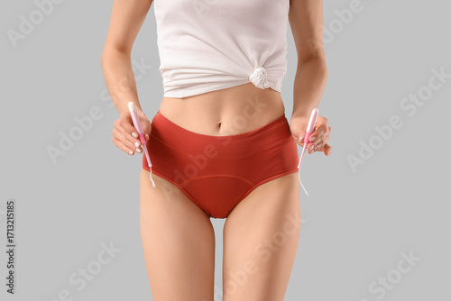 Young woman in red menstrua...