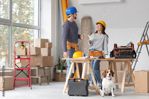 Young couple with Beagle do...
