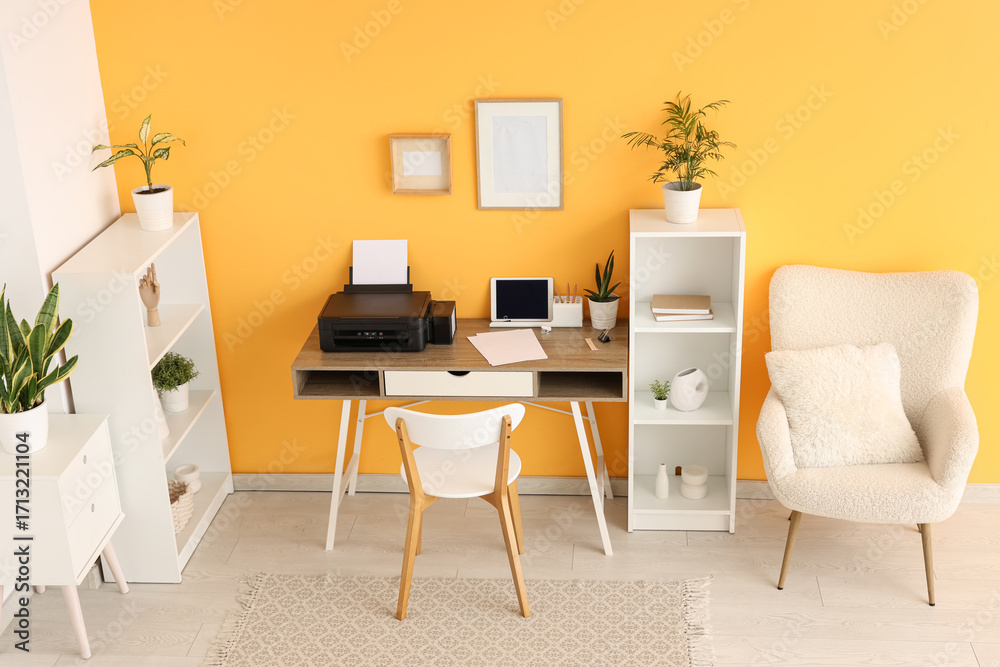 Fototapeta premium Workplace with modern printer and laptop in stylish home office