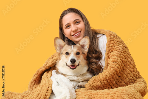 Young woman and Corgi dog w...