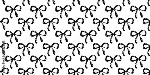 Seamless pattern of hand drawn black bows on a white background