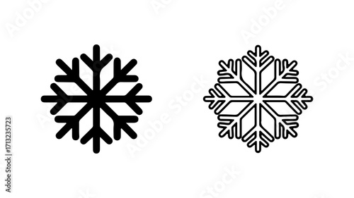 Set of two black snowflake vector icons solid and outline.