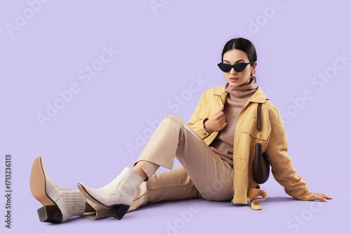 Stylish young woman in tren...