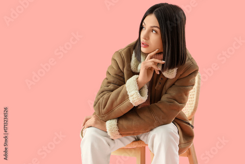 Thoughtful young woman in s...