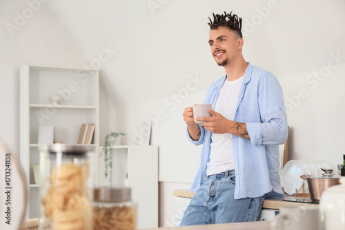 Young man with dreadlocks a...