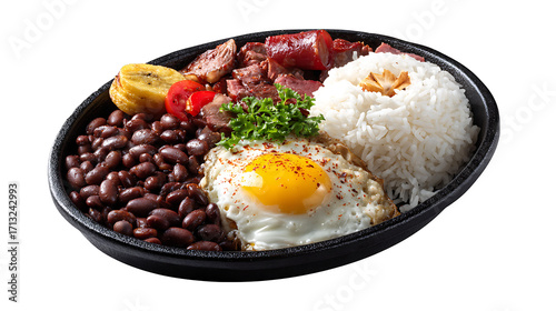 Colombian bandeja paisa with beans, rice, egg and meat, isolated on a white background