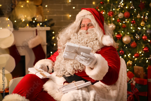 Santa Claus with letters in...