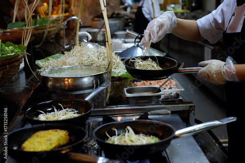 A chef is cooking Banh Xeo, a traditional Vietnamese food, at a resort buffet