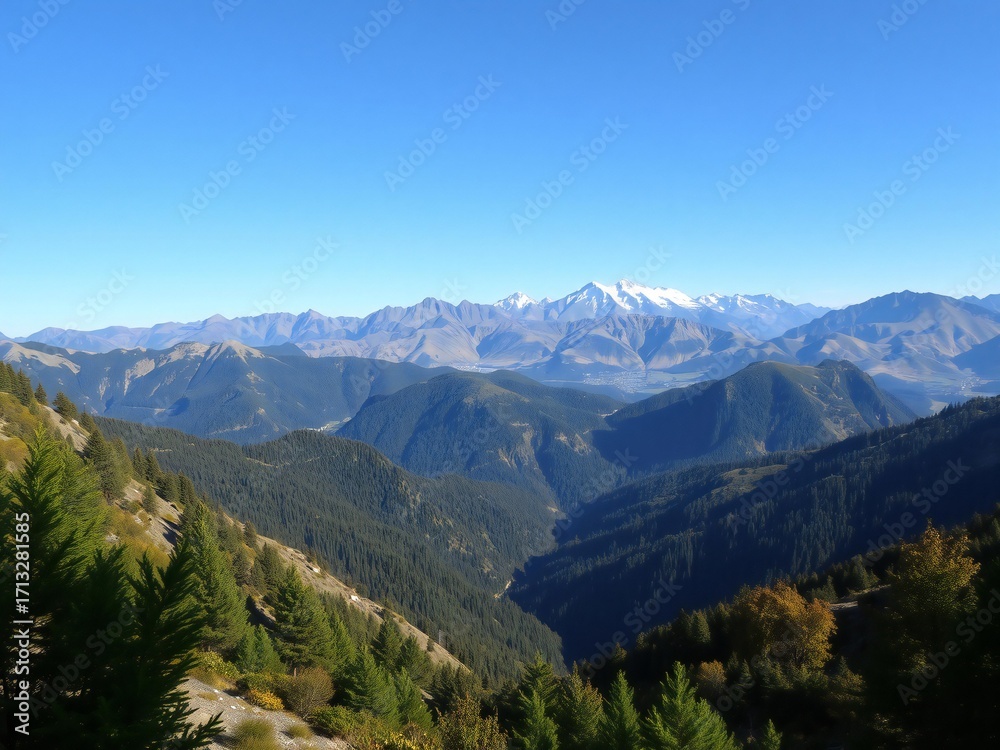 Fototapeta premium Expansive mountain range landscape under a clear blue sky