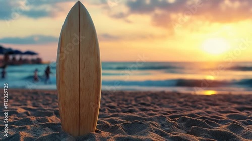 Surfboard on a beach at sunset