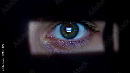 Intense gaze watching digital content reflected in eyes cinematic video