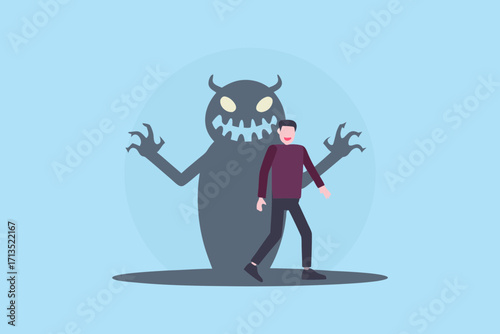 Man walking with a large scary monster shadow behind him representing inner demons or fears