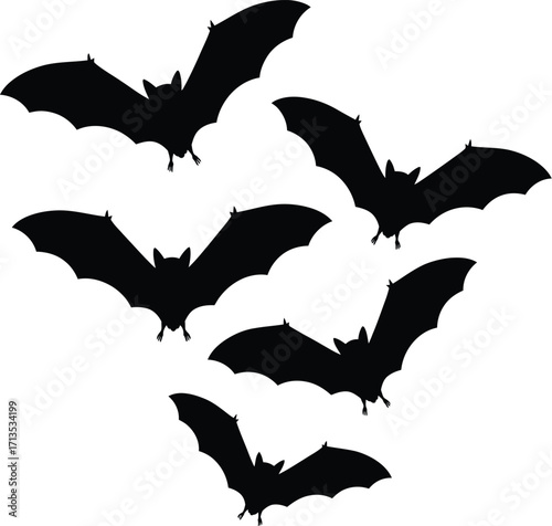 Flying black bat silhouettes vector