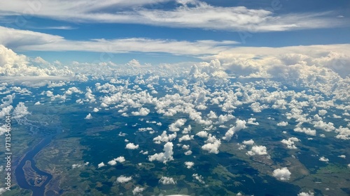Obraz na plátne Aerial View of Tropical Jungle and Clouds Over Vast Landscape in Daytime Adventu