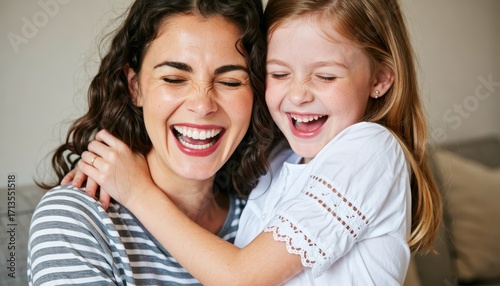 Joyful moments mother and daughter indoor setting candid embrace warm atmosphere family bonding