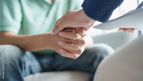 sad male sitting on sofa Patient discussing mental health issues with psychologist. depressed asian man mental health treatment