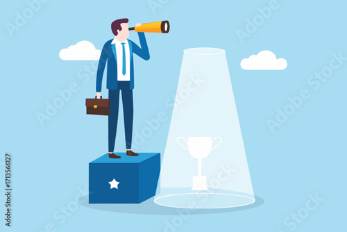 Businessman with telescope looking towards a trophy illuminated by spotlight