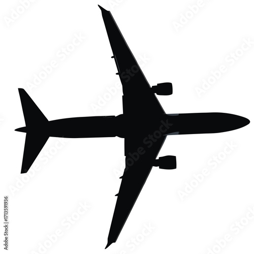 Silhouette of a passenger airplane seen from directly underneath
