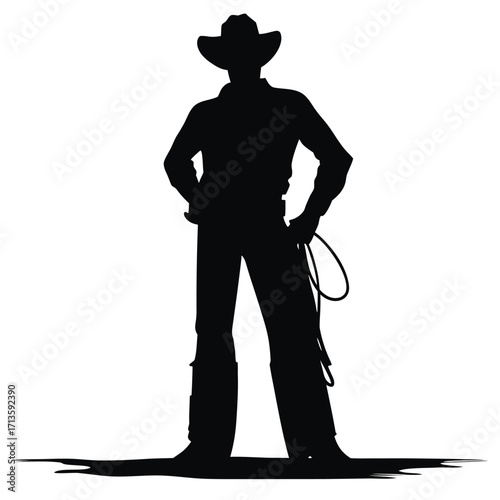 Silhouette of a cowboy standing with a rope in hand