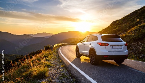 White SUV car driving on a scenic mountain road during a beautiful golden sunset.
