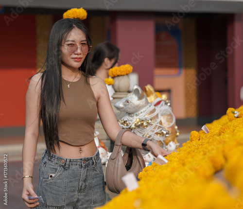 Thai Girl at Temple & river to make merit 
